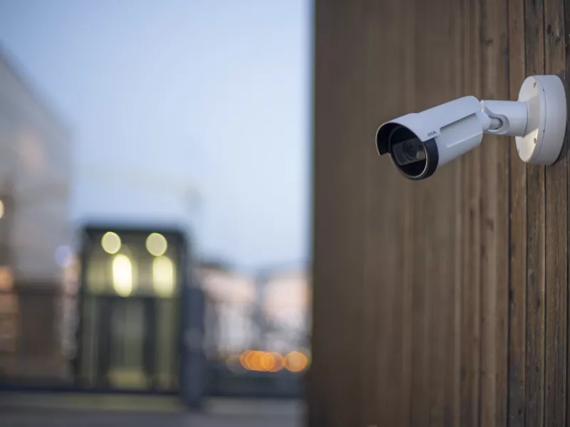 Bullet camera on wooden wall